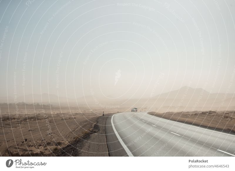 #A0# Calima III Fuerteventura Canaries Canary Islands canary island Street Road traffic Pavement Fog Sand Sandstorm Weather Weather phenomenon Volcanic island