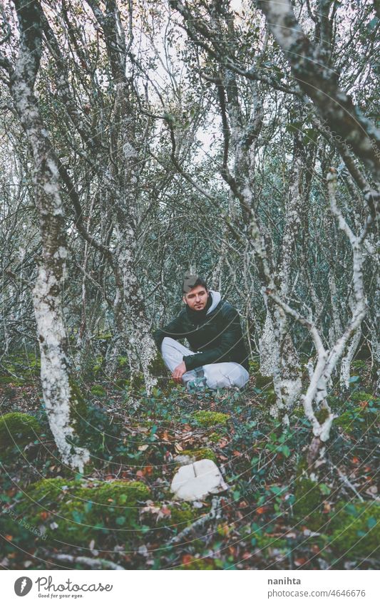 Young man alone in a huge forest adventure nature forestx man explore travel trip lost calm quiet place wicked adventurer explorer genuine brave survivor trees