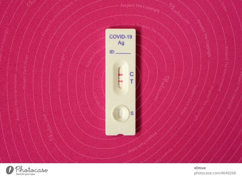 Test Strip Covid-19 Antigen Rapid Test with - Positive - Display on Wine Red Background / Test Result Positive Quick test self-test Antigen test covid-19