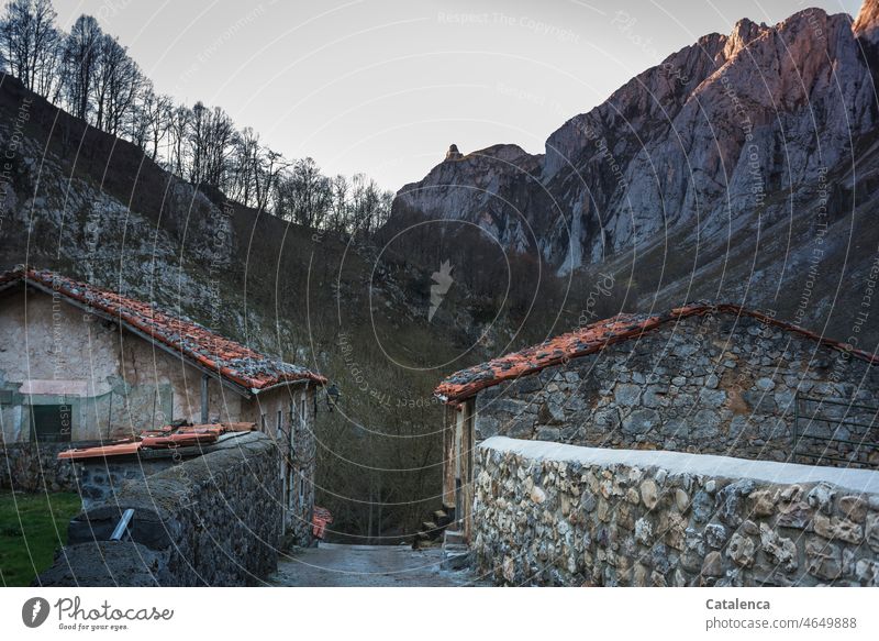 At the ass of the world | the paths stop daylight Day brick mountains door Wall (barrier) Wall (building) Old Stone Roofing tile Building Sky Clouds Plant