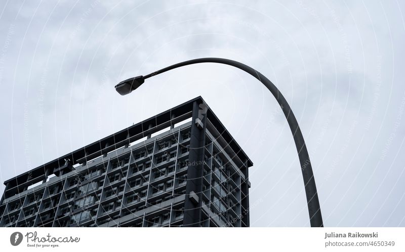 Corner of skyscraper and lantern - architectural photography geometric Capital city lines Architecture Large Gloomy urban Town Gray Subdued colour Sky