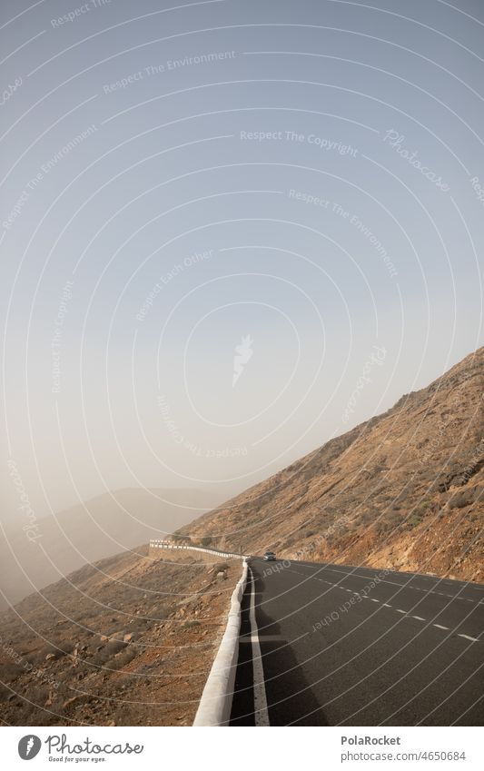 #A0# Mountain road Calima Deserted Dawn Landscape Nature Fuerteventura Exterior shot Shroud of fog Adventure Fog Misty atmosphere Valley Street mountain road