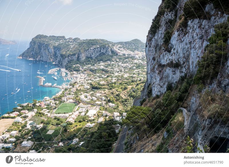 View of Capri and the harbor, Capri, Italy Ocean Vantage point Water mountain Harbour coast bank Island Beach Summer Sky Horizon Green Blue variegated foliage