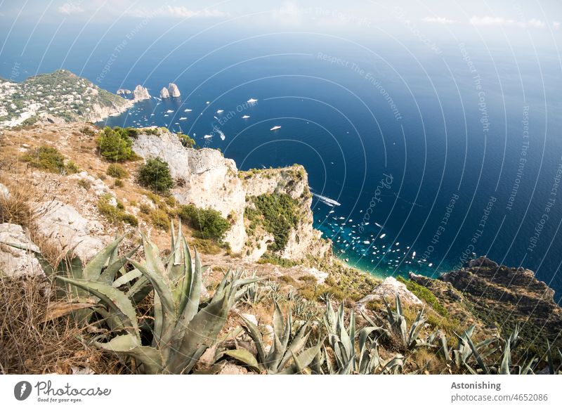 Faraglioni rocks in the distance, Capri, Italy Ocean boats Water Under Blue White stones Bottom of the sea clear Transparent bank coast yacht Landscape Nature