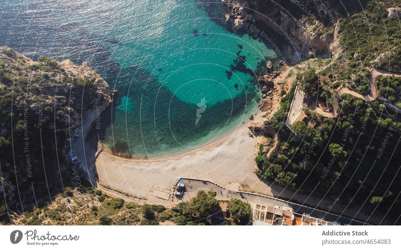 Picturesque view of turquoise seawater in bay with green cliffs nature lagoon resort seascape coast ocean picturesque landscape idyllic tree tropical formation