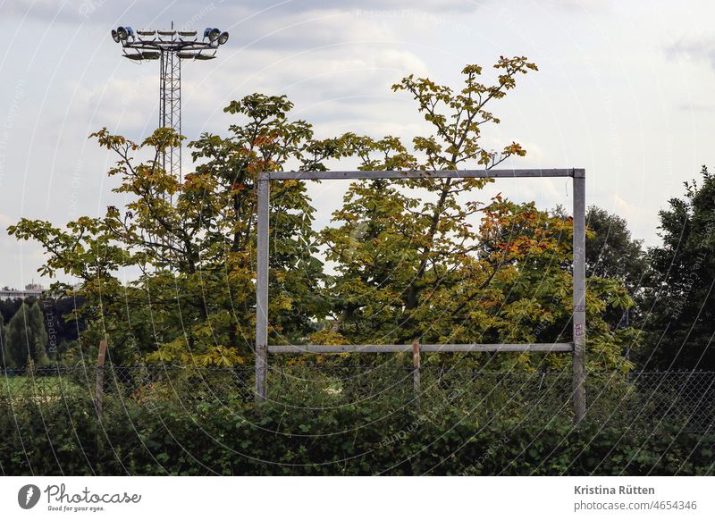 billboard without advertising Frame metal frame Scoreboard Billboard Empty Floodlight Racecourse Erstwhile forsake sb./sth. Bushes shrubby Fence