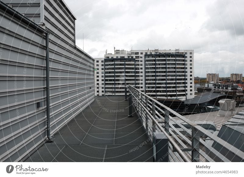 Modern architecture with rain clouds on a rainy day in the district Havenwelten in Bremerhaven on the Weser river in the Hanseatic city of Bremen Climate House