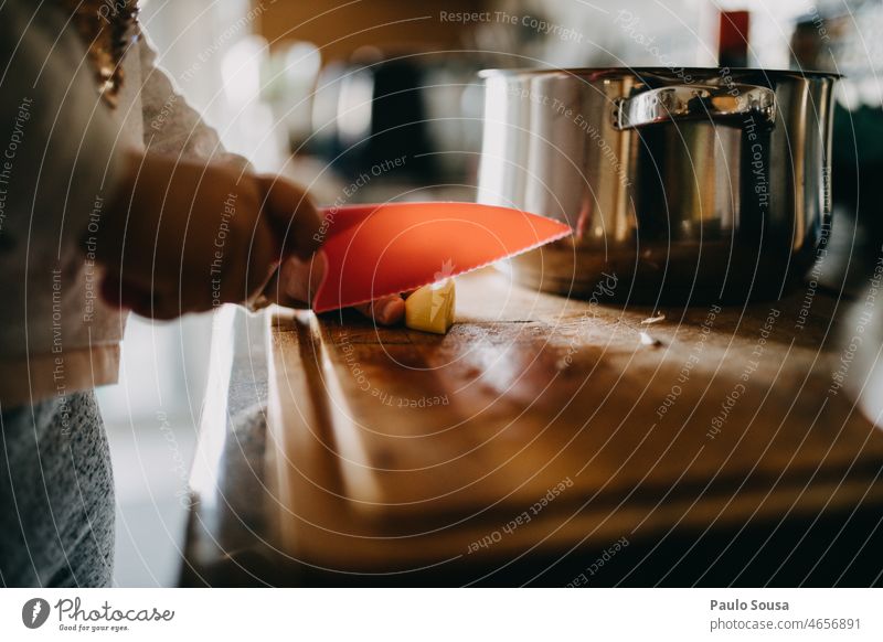 Child preparing food childhood 3 - 8 years Knives knife Cooking Preparation prepare cooking Kitchen Colour photo people Authentic Wood kitchen