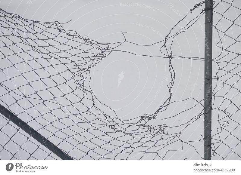 damaged fence abstract wire shapes hole white snow background chain link torn cold winter squares metal iron lines circle minimalism chain-link netting mesh