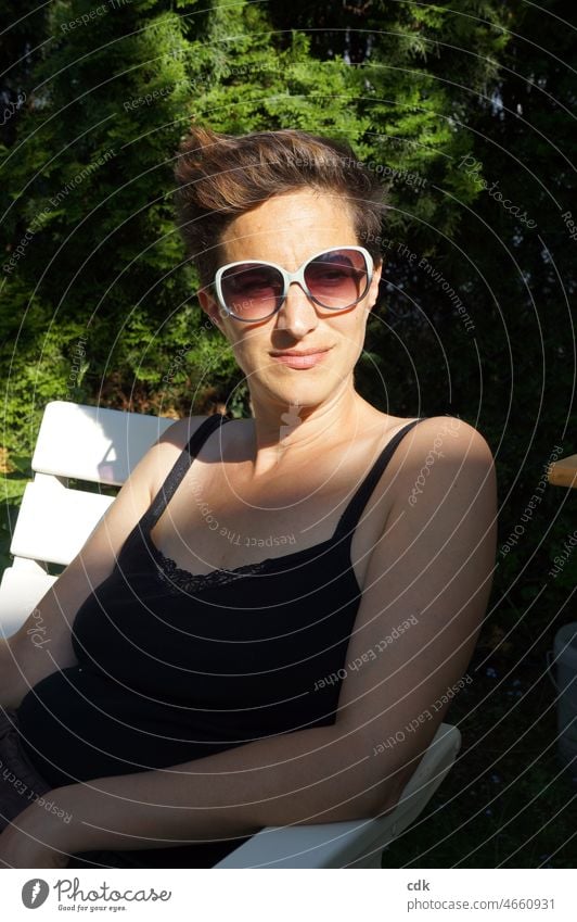 Sitting in the late summer light and soaking up the sun. Adults Woman portrait Smiling Face look consider Observe Summer Nature Moody sensation waiting