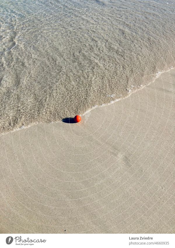 Red ball for the beach fun Ball Fun Wave Ocean water play sea Sand calm red deserted