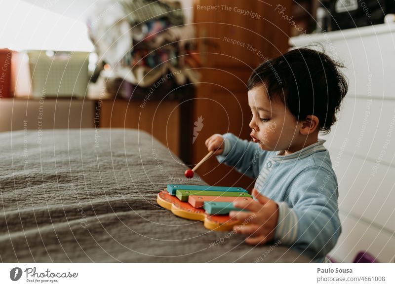 Child playing xylophone childhood having fun Authentic happy kid joy Playing Happiness Infancy Colour photo Xylophone Toys wooden Music Musical instrument Joy