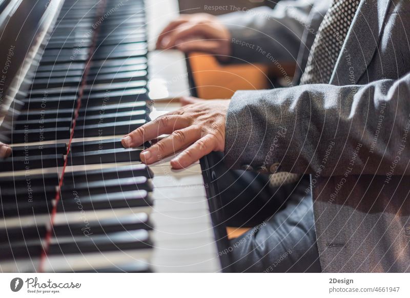 Close up view of gentle male hands playing a melody on piano person music pianist musician key finger closeup instrument adult classical keyboard musical