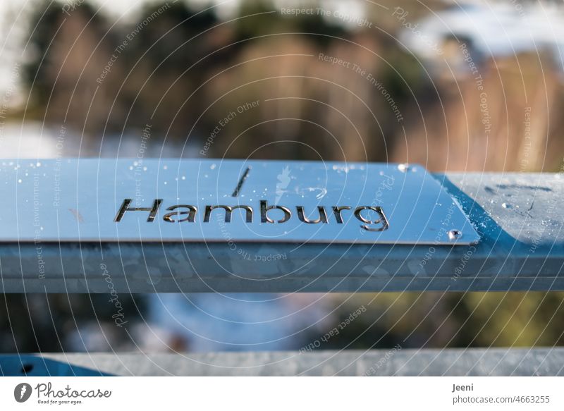 View towards Hamburg Word Road marking Direction vantage point Lookout tower Orientation Arrow Winter Snow Tall Signs and labeling Clue Right Hanseatic City