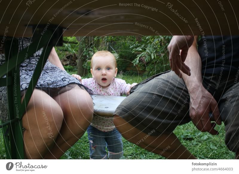 Toddler between mother and father Parents Between Adults father and mother Together Baby between them Firstborn Considerate Hold parenthood Family stand-alone