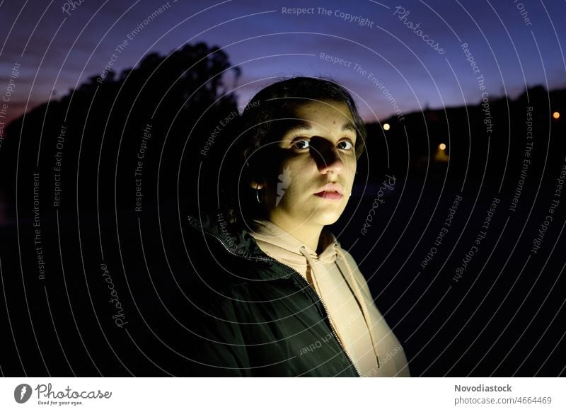 Portrait of a teenage girl looking at the camera, outdoors during sunset teenager portrait face gesture expression young lifestyle casual sunset light dawn dusk