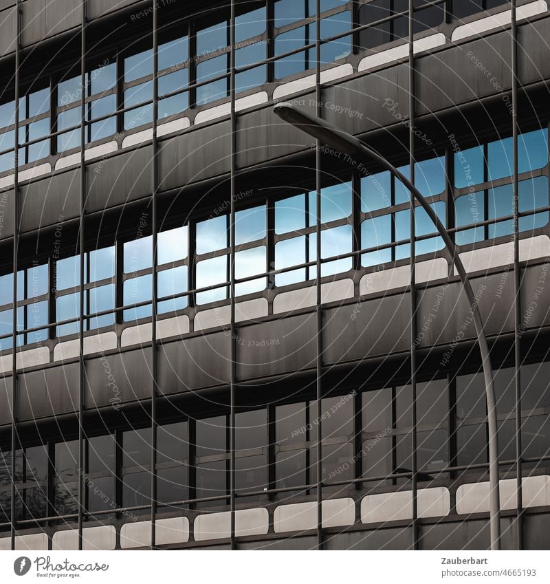 Modern facade with concrete and glass, sealed sky and street light Facade Concrete Glass urban Lantern streetlamp reflection Sky Blue Town Architecture Building