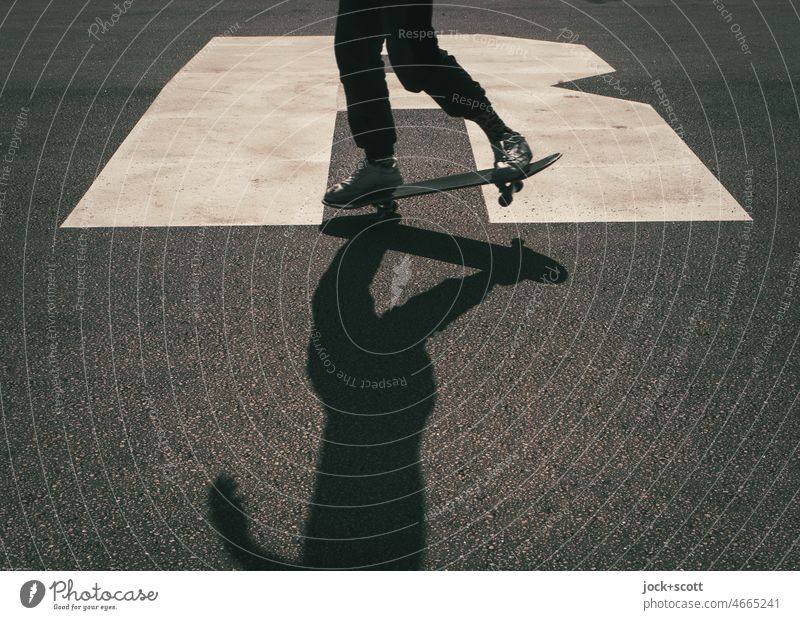 nose manual skateboarding Skateboarding Youth (Young adults) Athletic Attentive Posture Lifestyle Silhouette Signs and labeling Shadow Leisure and hobbies