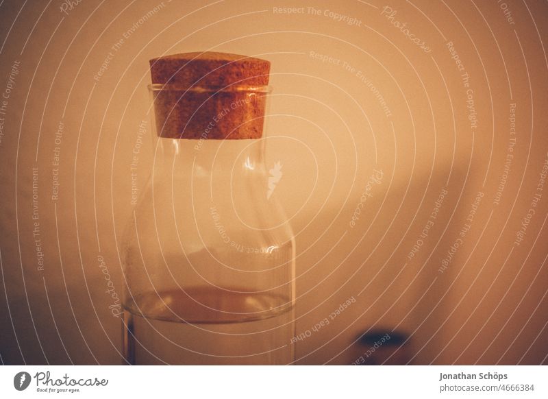 Glass bottle with cork Glassbottle Drinks bottle Bottle Cork Close-up at home Artificial light Colour photo Neck of a bottle Beverage Deserted Detail