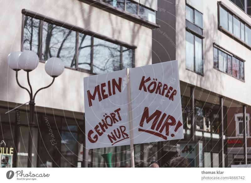 Demonstration with white sign and red writing protest Solidarity demonstrate Politics and state Protest Responsibility Signs and labeling Freedom of expression