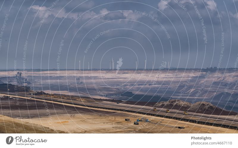 Garzweiler open pit mine. Lignite mining and wind turbines turning in the background co2 Brown North Rhine-Westphalia Threat Mining Sand Force Energy Nature