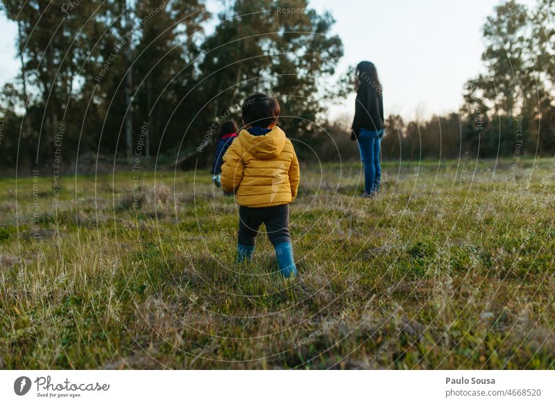 Mother and children playing outdoors motherhood Family & Relations three people Child childhood Unrecognizable Caucasian Happy Lifestyle Parents Infancy