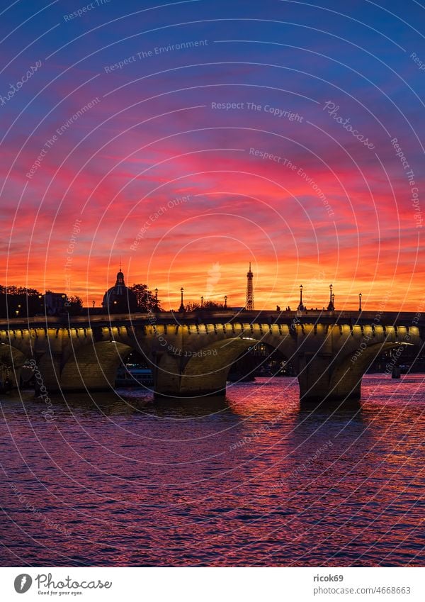 View of Pont Neuf bridge at sunset in Paris, France Building Architecture Town Bridge River Seine Tourist Attraction Sunset Historic Old Water Autumn his bridge