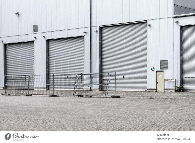 Different size driveways on an industrial area, fences in front of them Industry Fence urban Town City Harbour Production Highway ramp (entrance) Garage Vehicle