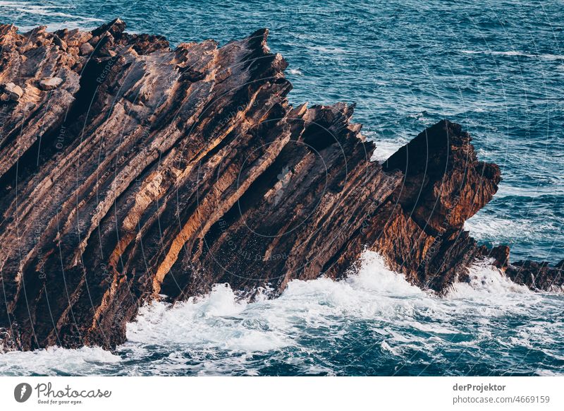 Surf on beach on Peniche peninsula in Portugal with rocks Nature Environment abandoned place forsake sb./sth. coast Ocean Emotions Loneliness Gray Gloomy