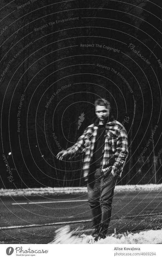 can’t stay still blackandwhiteportrait portrait of a man blurry winter snow standing in snow Black and white photography kicking kicking snow Movement move