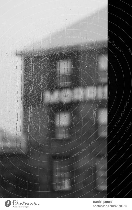 Old Warehouse Through Rainy Window Old building Historic Buildings out of focus Black & white photo Gloomy rainy Drops of water raindrops grey sky Gray grey day