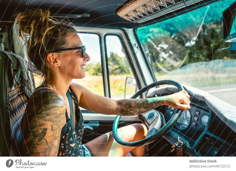 Woman driving caravan car woman tourist drive trailer road trip camper vacation female driver adventure steering wheel transport wanderlust travel cantabria