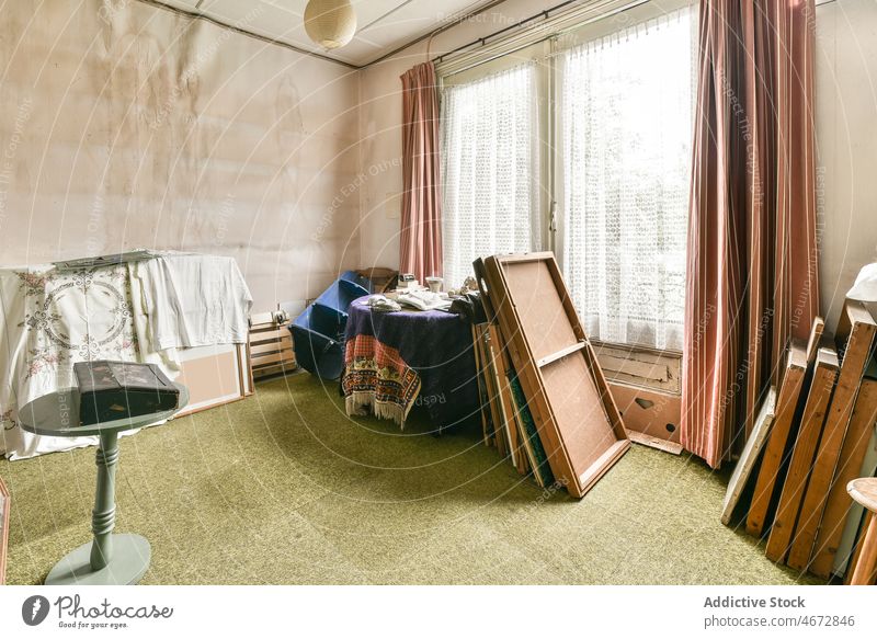 Interior of room with old junk in cottage stuff interior storage weathered shabby house retro vintage antique various assorted abandoned different daylight