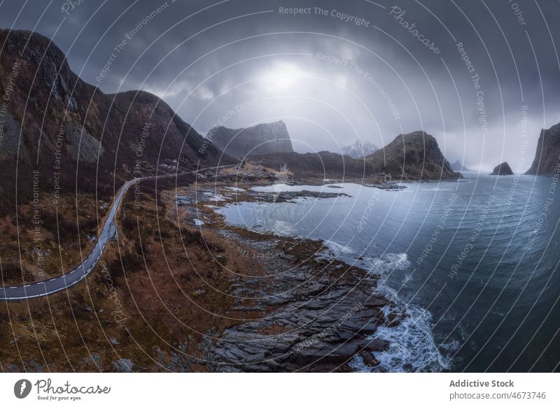 Sea washing rocky coast in Norway water sea overcast archipelago mountain cliff nature waterfront tide norway beach Vik stone gloomy lofoten scenic seafront