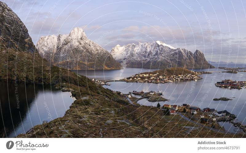 Lofoten island with snowy mountains sea coast archipelago water nature lofoten winter environment scenery marine natural scenic norway aqua shore cloudy grass