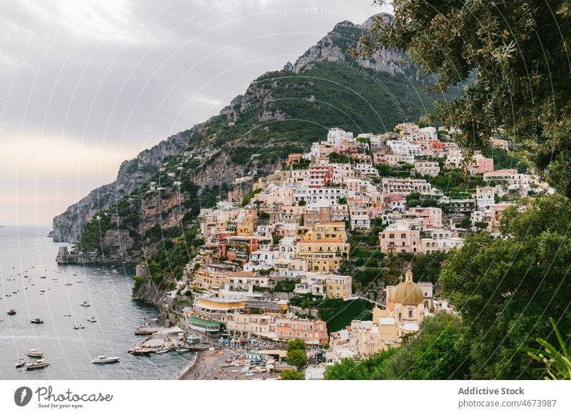 Buildings on slope of mountain near sea building town water coast house waterfront beach italy environment aqua europe shore seaside seashore scenery location