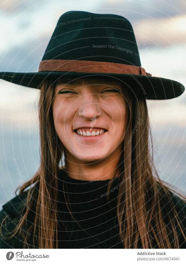 Peaceful smiling woman in hat on shore peaceful tranquil sea smile water style embankment nature harmony trip happy tourism coast delight beach glad female