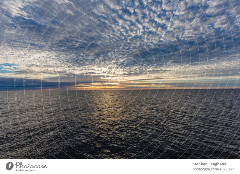 Picture of dramatic cloudy sky on sea at sunrise in summer nature water landscape sunset ocean beach dark blue sunlight dusk gold travel dawn cloudscape coast