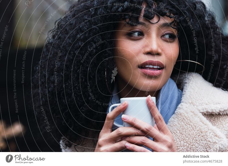 Smiling black woman with cup of coffee drink relax rest house home chill coffee break warm female portrait african american woman mug hot drink positive