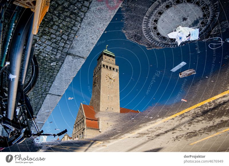 City Hall Neukölln in a puddle reflection with garbage II puddle mirroring Trip Tourism Copy Space middle touristic City life Contrast Copy Space bottom