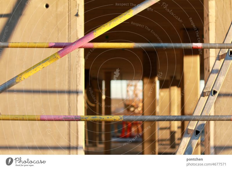 View through a building under construction. Construction site, new construction, real estate industry, construction work, scaffolding Scaffolding