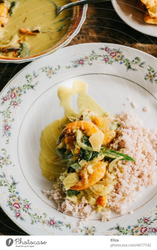 Shrimp curry with rice on a plate Curry powder Asian Indian Eating Yellow Delicious Dish Plate Shrimps Seafood Meal Exotic Kitchen