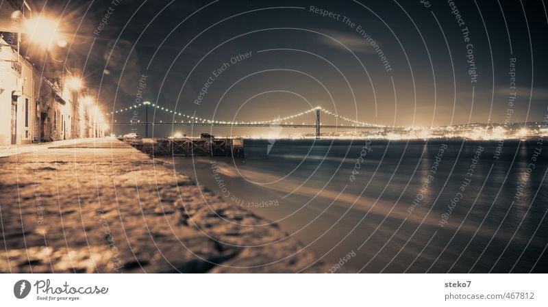 Tejo at night River bank Town Port City Industrial plant Harbour Bridge Wall (barrier) Wall (building) Dark Cold Blue Brown Lisbon Subdued colour Exterior shot