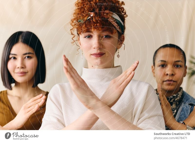 Young white woman gesturing Break The Bias in support of International Women's Day with multi ethnic female friends international womens day iwd empowerment