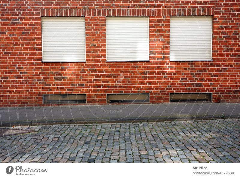 triad Facade Roller shutter Closed City life Venetian blinds Identical Town House (Residential Structure) Old building off Street roller shutter Sidewalk