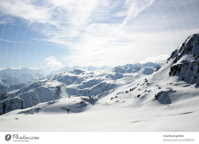 alpine Alpine Snow Mountain Ski run Alps Panorama (View) Snowscape Snow layer Ski resort Mountain range Clouds in the sky Far-off places Vantage point