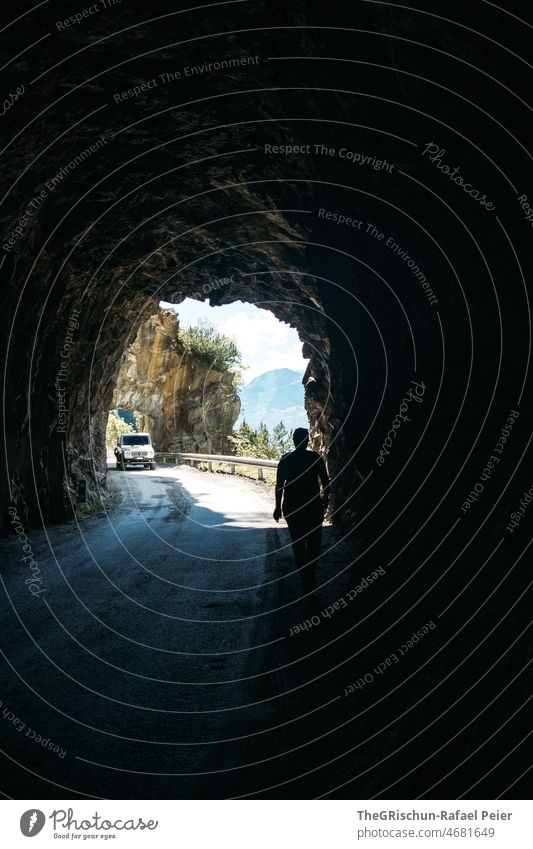 Woman in tunnel on road Tunnel Dark Light Street car Mountain Contrast darkness Light at the end of the tunnel