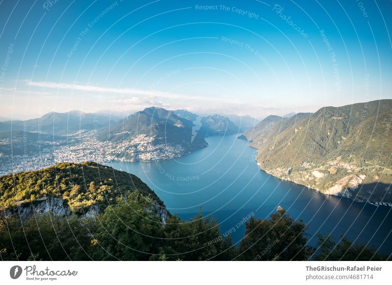 View of lake with mountains in background Lake Lake Lugano Village Mountain Sky Vantage point Switzerland Ticino