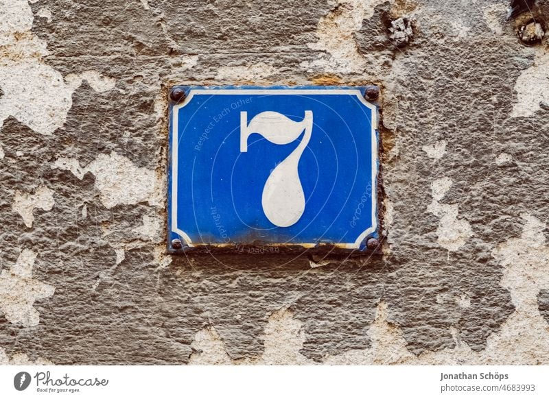 Seven - house number on wall sieving 7 House number Blue White sign Enamel Wall (building) Facade dwell House (Residential Structure) Typography typography