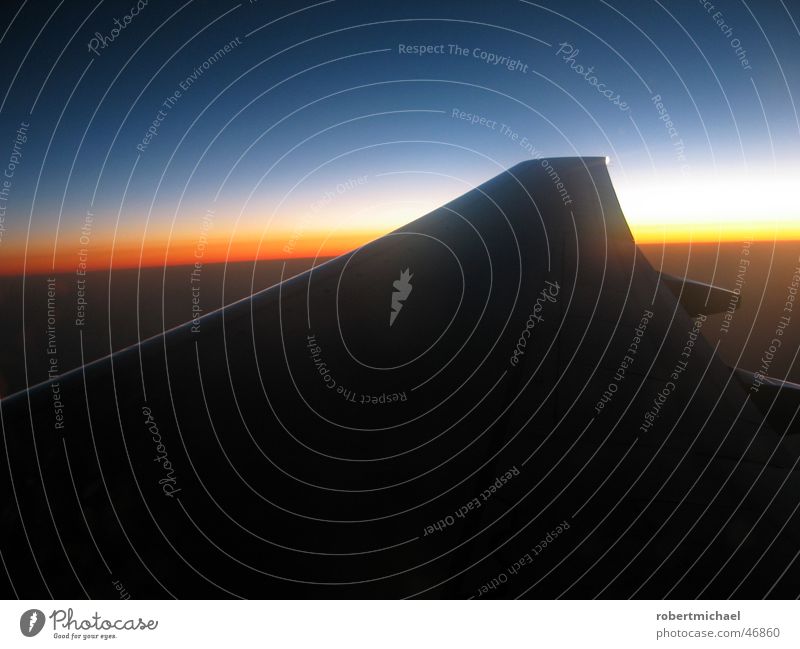 above the clouds Sunset Airplane Horizontal Line Wing Right Engines Clouds Infinity Dazzle Color gradient Dark Black Sharp-edged Variable Cloud cover Yellow Red